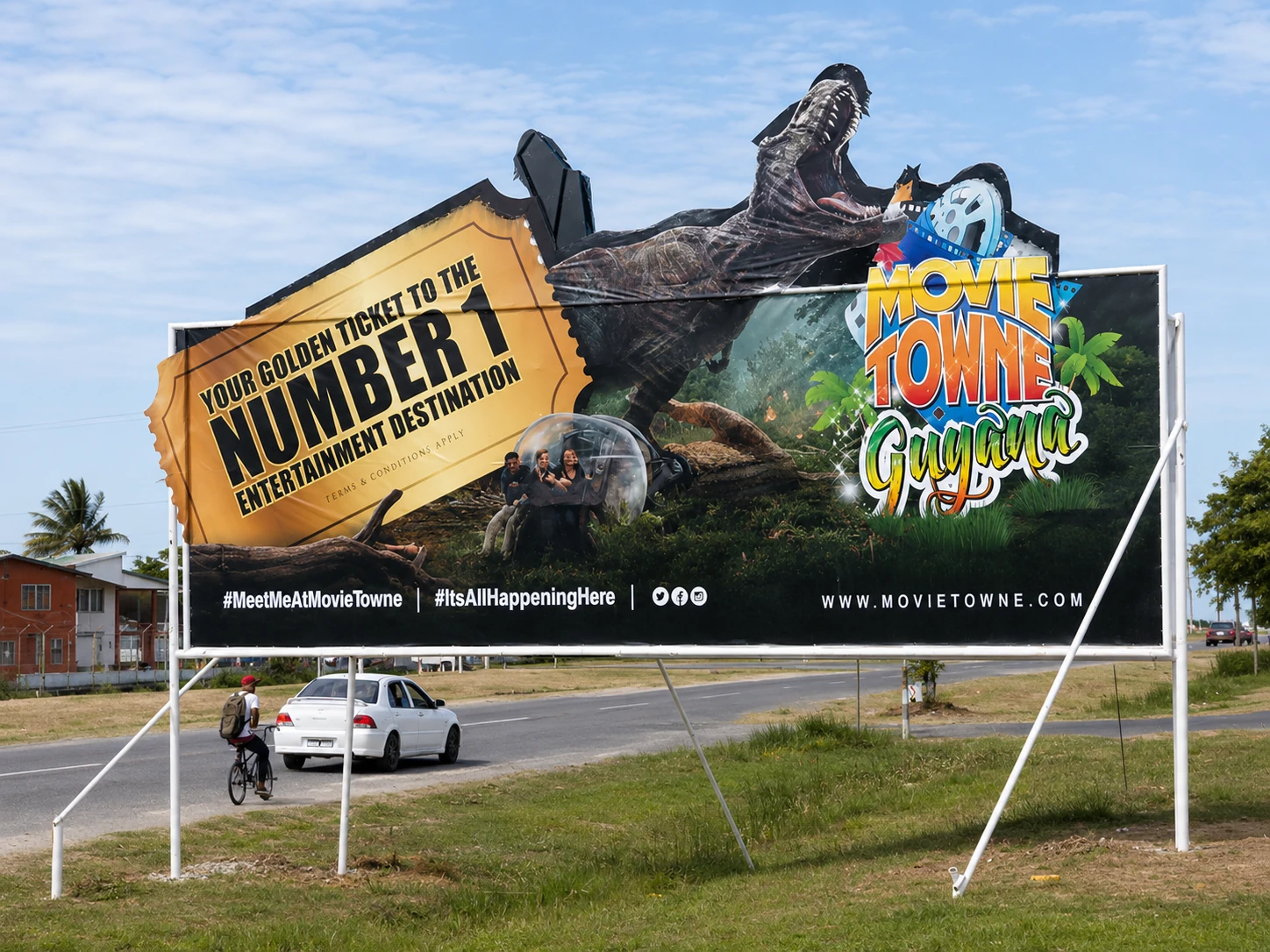 MovieTowne Guyana roadside billboard with shaped dinosaur and ticket graphics