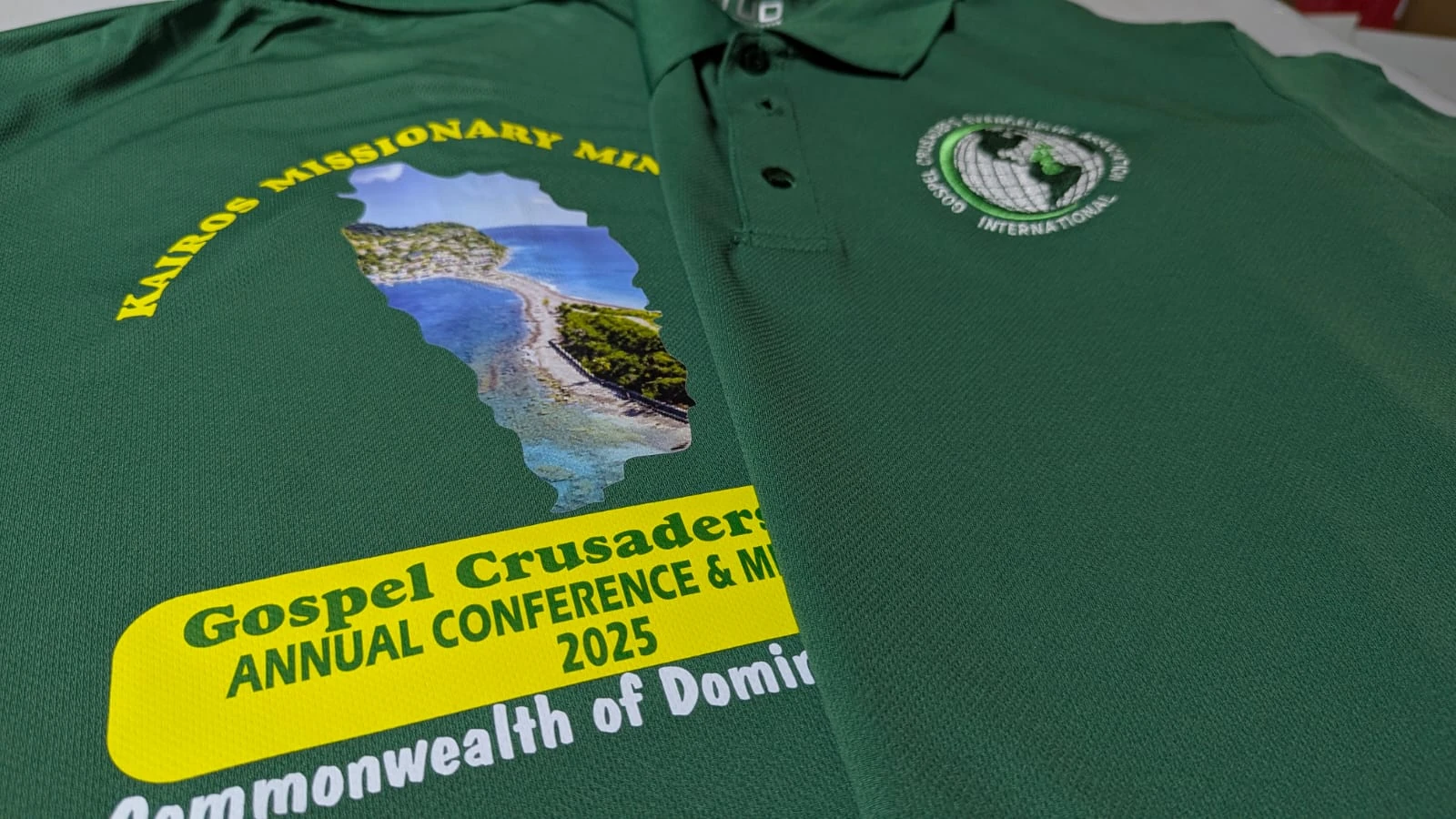 Green polos with detailed DTF artwork and an embroidered chest logo