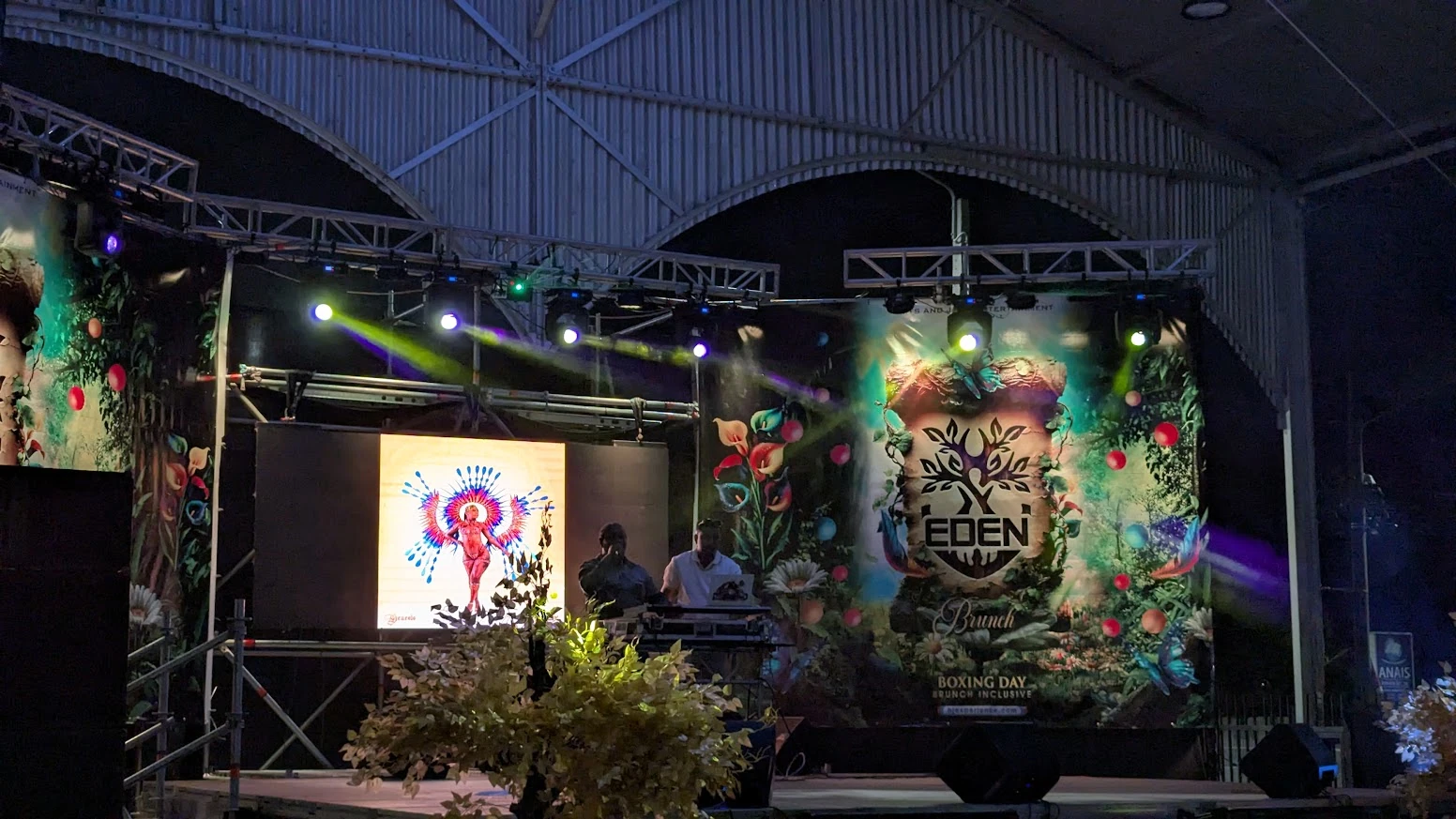 Eden event stage with large printed backdrop and side panels
