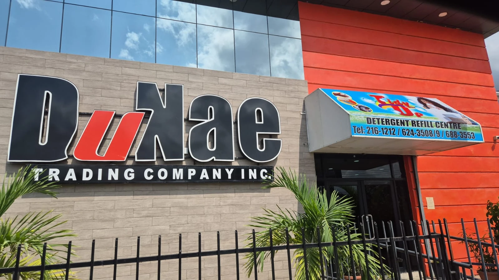 DuNae Trading Company storefront lettering and Tidy Up entrance sign